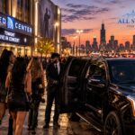 All Star Limo chauffeur greeting a group outside the United Center before a concert, with a packed parking lot in the background