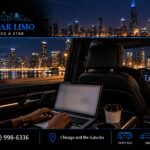 Passenger working on a laptop in the back seat of a black SUV at night, with the Chicago skyline and lakefront passing by as a gloved chauffeur drives